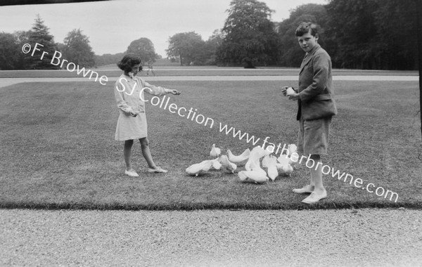 ANTHONY AND MYRA BUTLER FEEDING PIDGEONS  VISCOUNT THURLES